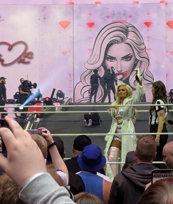 Mariah May makes her entrance, shoe in hand, at Wembley Stadium