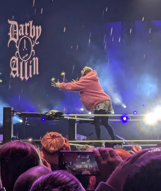 Darby Allin gestures to the Wembley crowd during his entrance