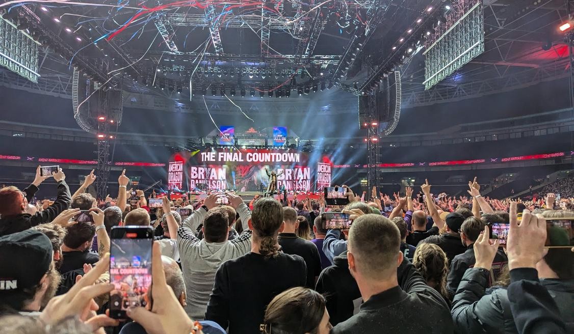 Bryan Danielson poses for the Wembley crowd during his entrance
