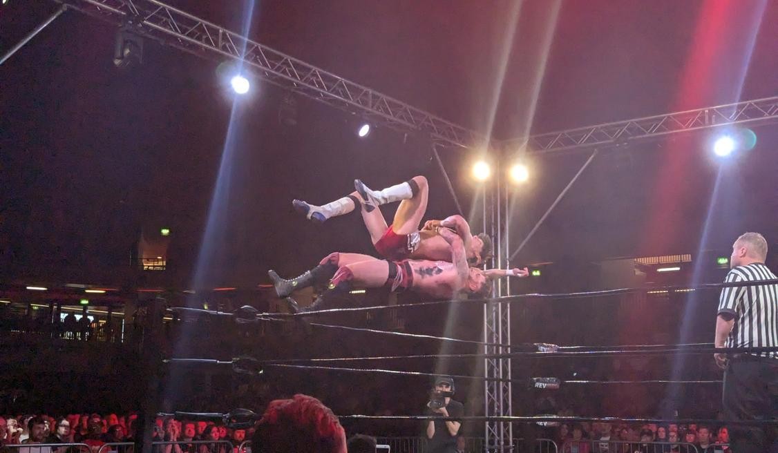 Ricky Knight Jr. suplexing Zozaya from the turnbuckle