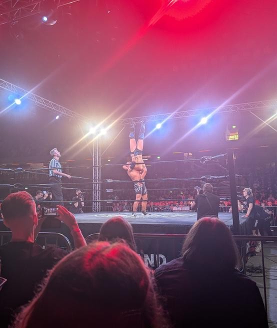 Tomohiro Ishii delivering a vertical brain buster to JJ Gale